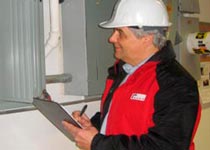 A RAND employee doing an energy audit.