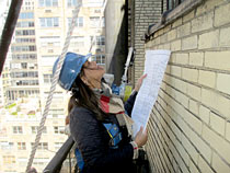 A Rand Employee doing a building survey